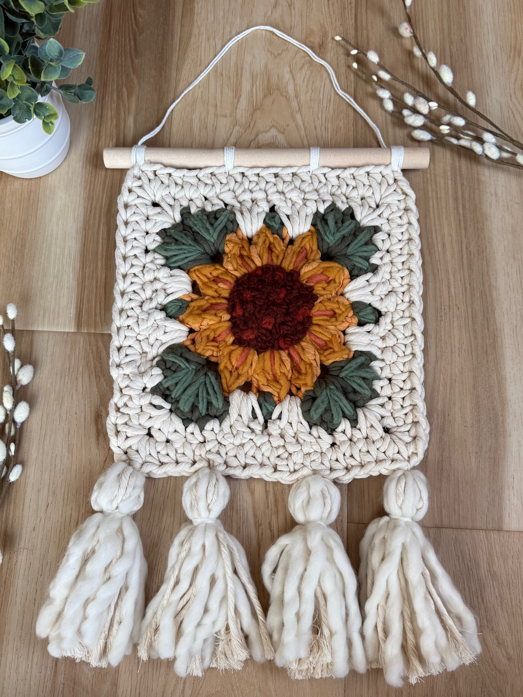 Sunflower embroidered granny square with tassels