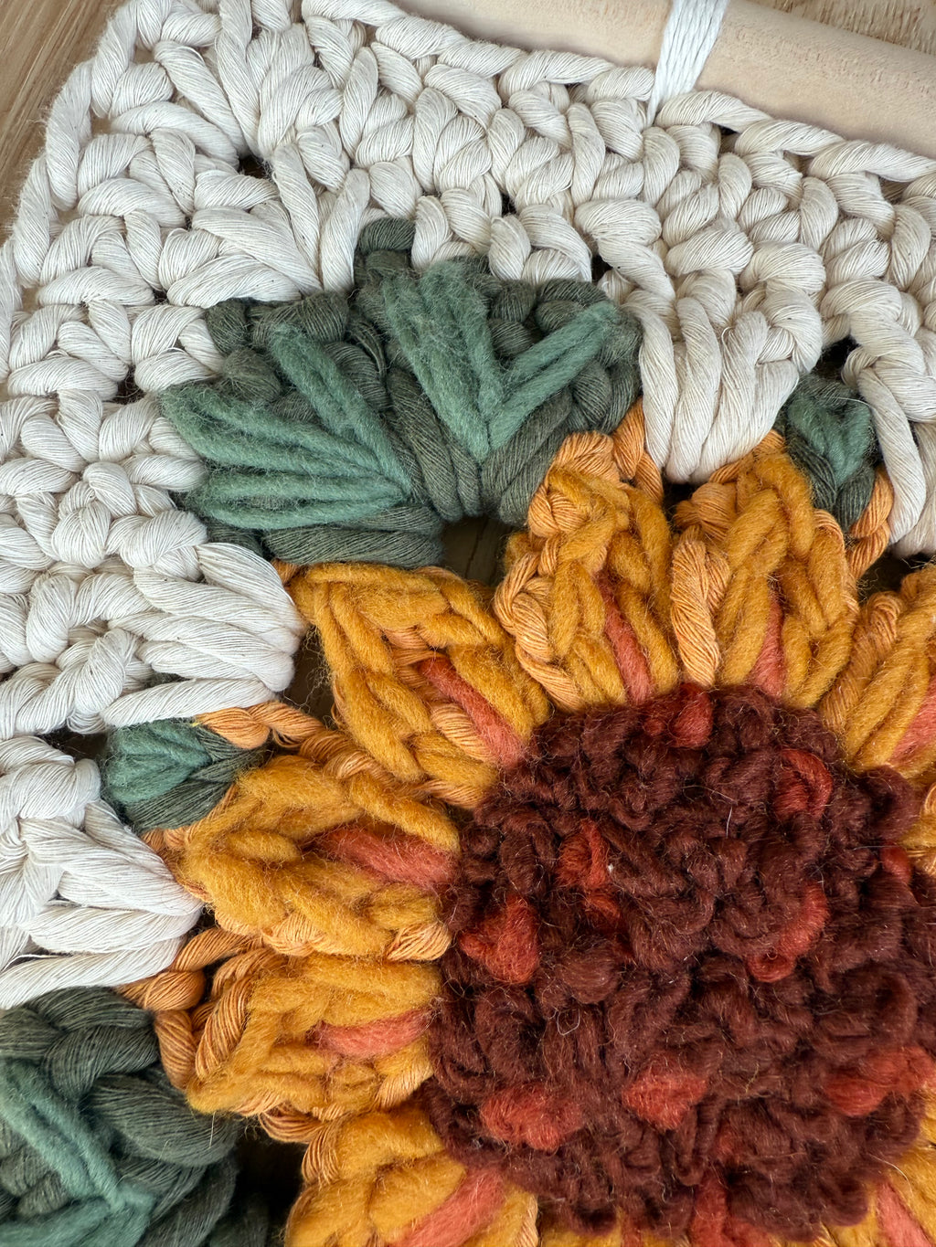 Sunflower embroidered granny square with tassels