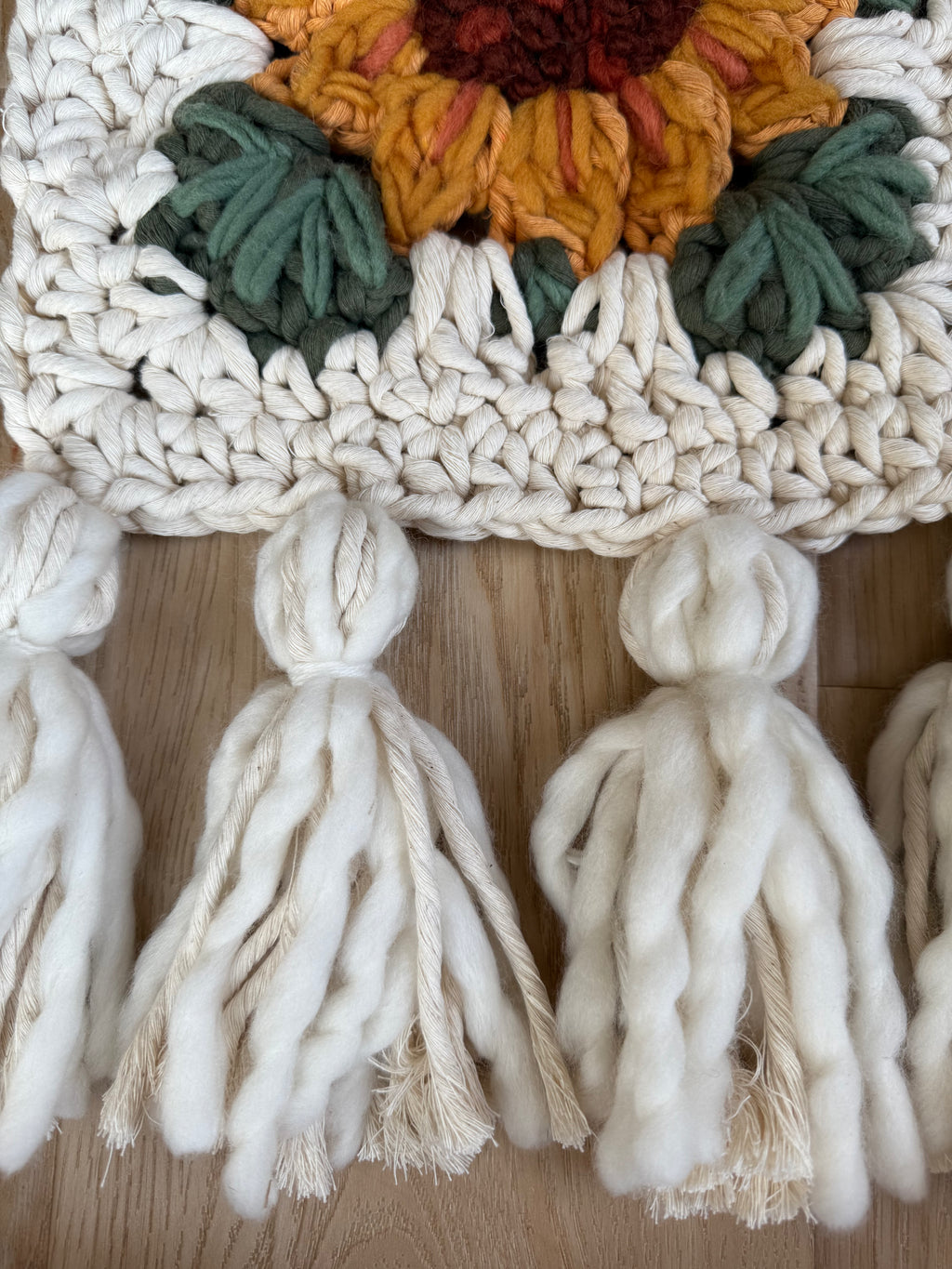 Sunflower embroidered granny square with tassels